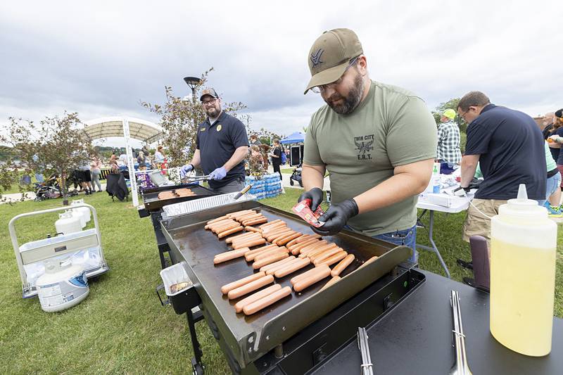 RFPD Det. Mitch Ottenhausen grills up the dogs Tuesday, Aug. 6, 2024 during National Night Out. The department fired 500 hot dogs for the night.