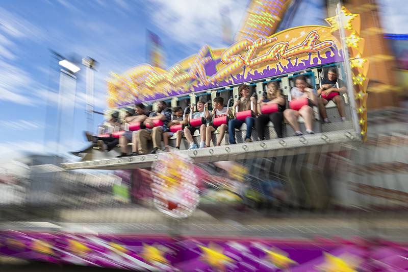 Riders hang on to the Rock Star Wednesday, July 3, 2024 during the first day of the Petunia Fest carnival. The carnival will be open on Thursday, Friday and Sunday from 1-11 pm and on Friday for a special needs time from 2-4pm before being open from 5-11.