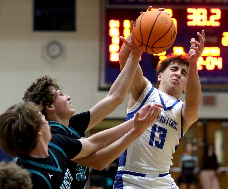 Woodstock's Ryan Murray grabs a rebound against Woodstock North's Ben Hendershot during a Kishwaukee River Conference boys basketball game on Wednesday, February. 18, 2026, at Woodstock High School.