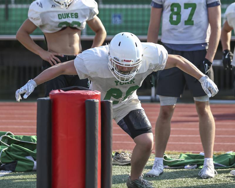 Henry Duda works on tackling at York High School football practice, Thursday, Aug 14, 2025  in Elmhurst.