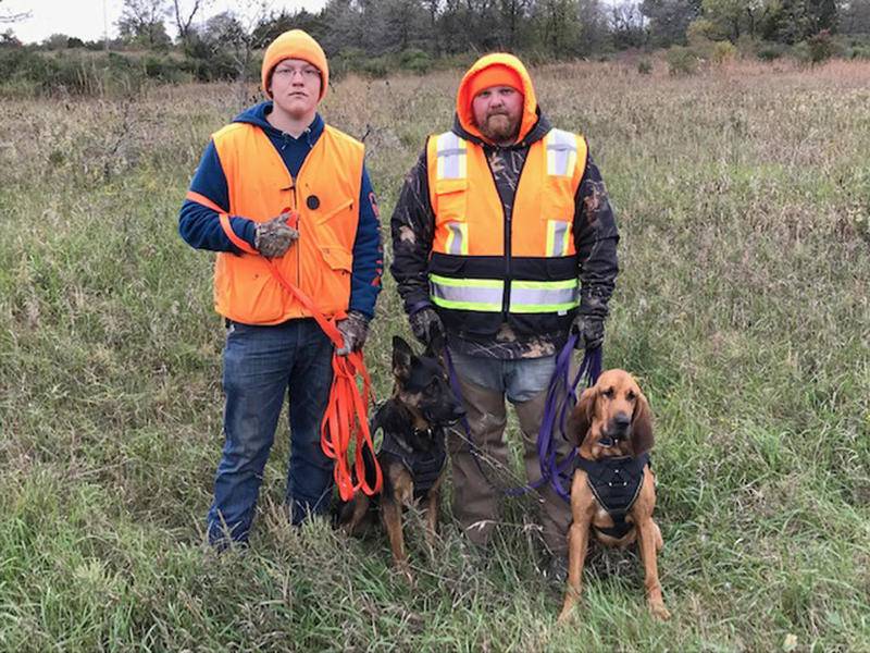 Tracking dogs helped young hunters find downed deer during the annual youth deer hunt Oct. 12 and 13 at the Lost Mound Unit of the Upper Mississippi R9ver National Wildlife and Fish Refuge in Savanna. Pictured are (left) Teddy Robbins, assistant handler, with Maverick, and Seth Nelson with Kimber. Submitted by Ed Britton.