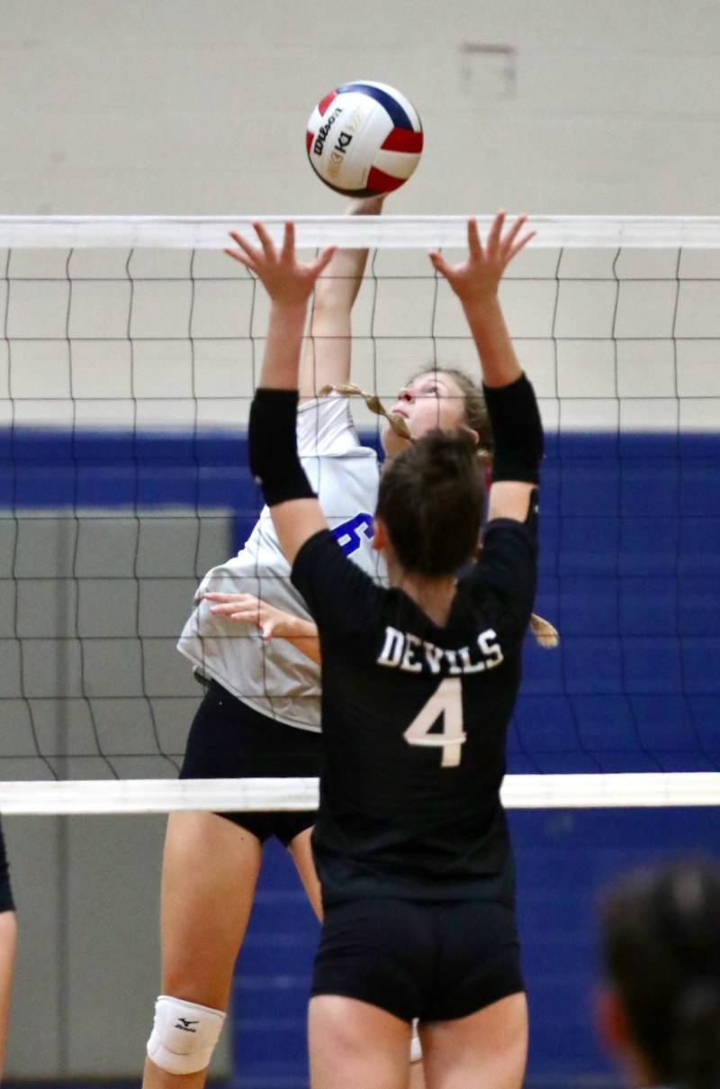 Princeton sophomore Caroline Keutzer takes a swing against Hall's Morgan Hoscheid Tuesday night at Prouty Gym.