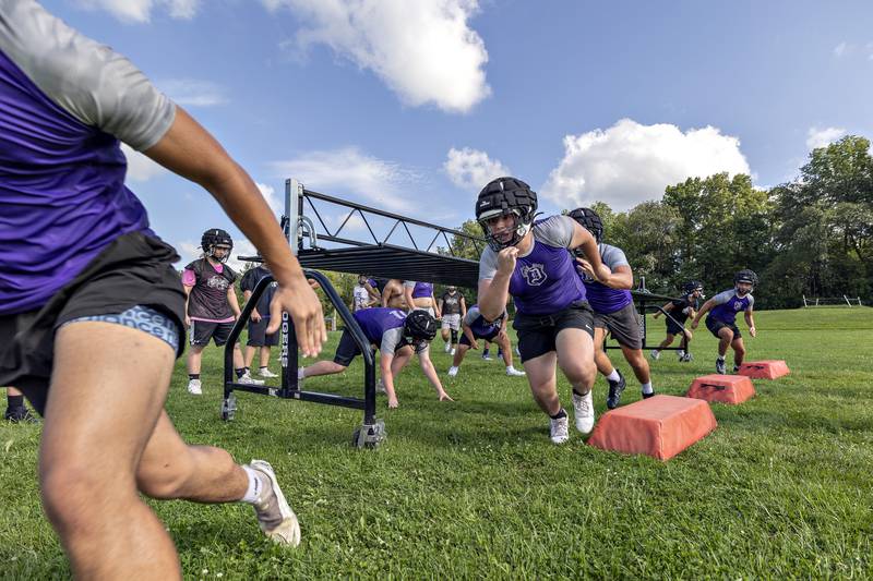 Dixon players run through drills Monday, August 11, 2025, for the first day of football practice.