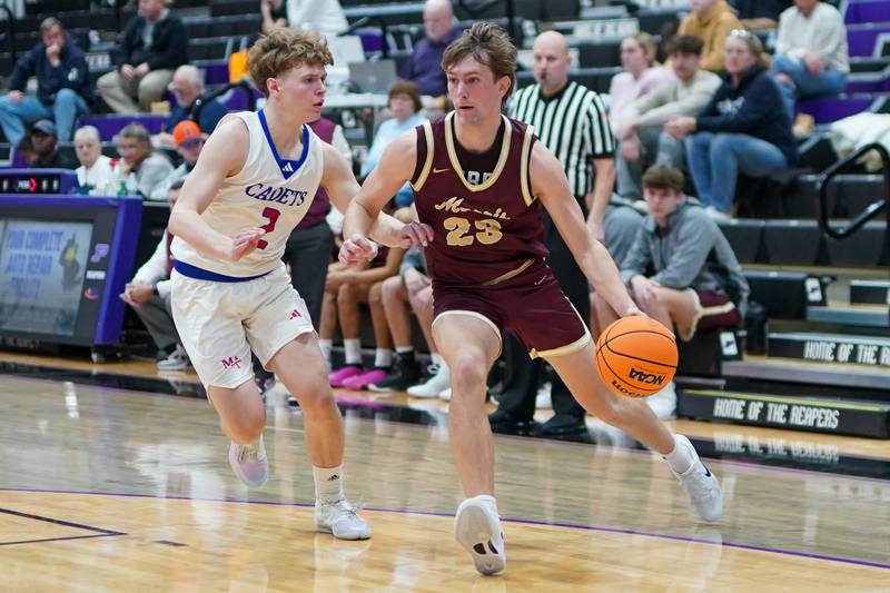Morris’ Jack Wheeler (23) drives to the basket against Marmion's Caden Anderson (2) during a basketball game in the opening round of the 61st annual Plano Christmas Classic at Plano High School on Monday, December 23, 2024.