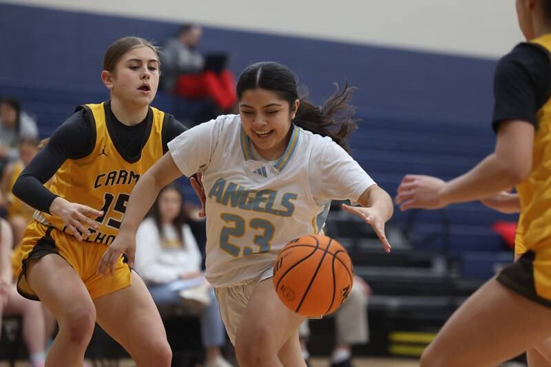 Joliet Catholic’s Breanna Zafra recovers the loose ball against Carmel on Wednesday, Jan 15, 2025 in Joliet.