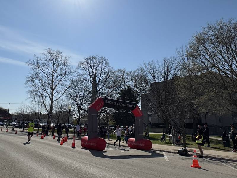 A child finishes his 5K run while amongst the other runners racing in both the 5K and 10K race Saturday, April 12.