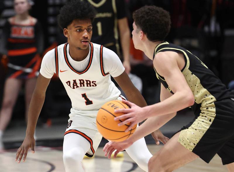 DeKalb’s Lamarrio Moore Jr. plays defense against Sycamore's Marcus Johnson Friday, Jan. 30, 2026, during the FNBO Challenge at the Convocation Center at Northern Illinois University in DeKalb.
