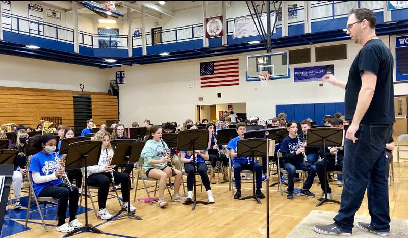 Woodstock North High School Band Director Bill Kraemer-Simpson leads band students during the Woodstock Community Unit School District 200 Band Festival on April 11 at Woodstock High School.