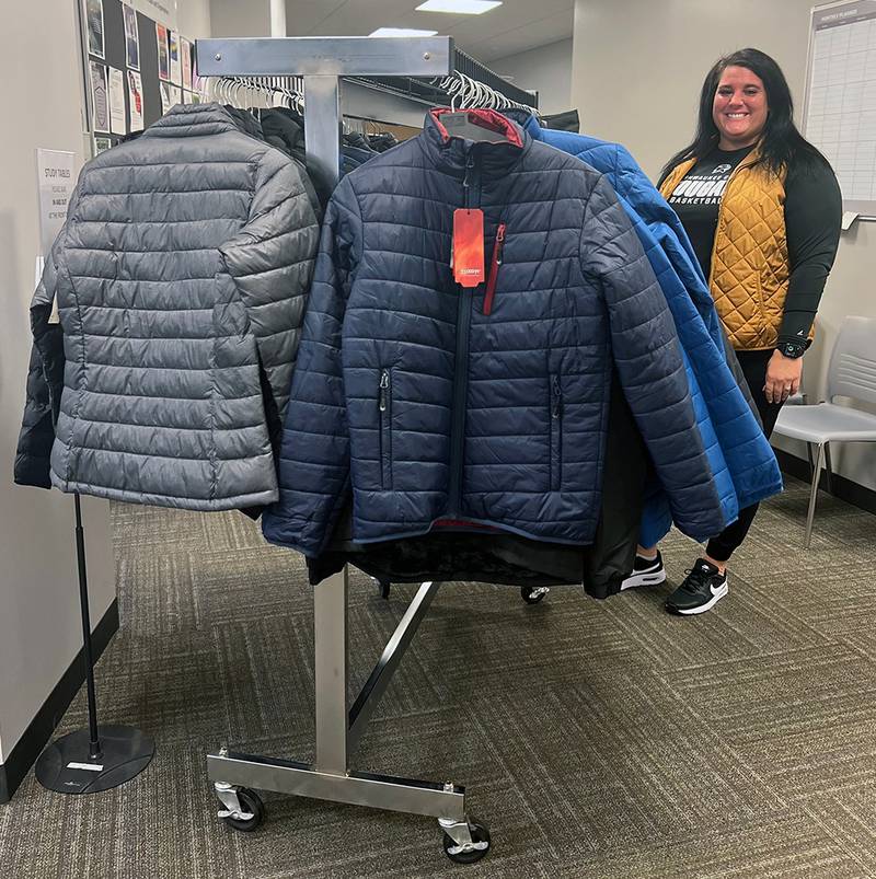Krystal Gundy, Coordinator of Student Activities, with the donated coats