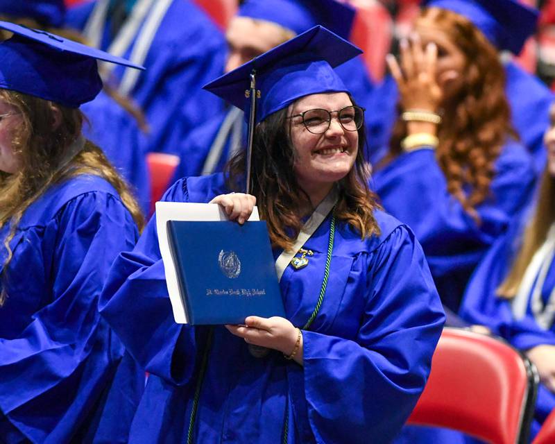 A St. Charles North graduate is all smiles as she shows off the diploma on Monday, May 18, 2026, held at the the NIU Convocation Center in DeKalb.
