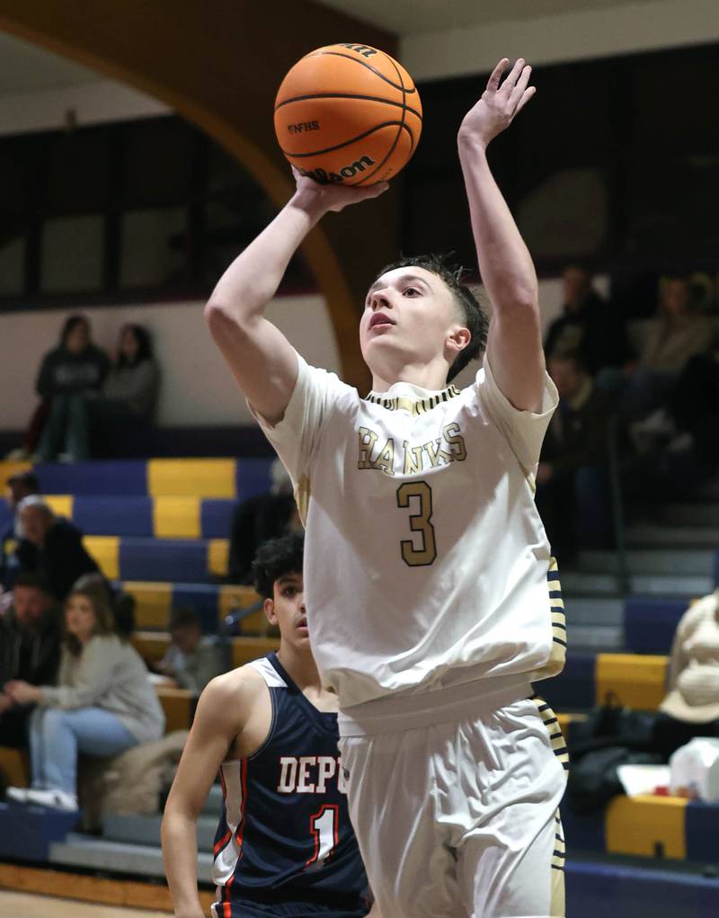 Hiawatha's Caiden Wiegartz goes to the basket infront of a DePue defender  during their game Tuesday, Jan. 20, 2026, at Hiawatha High School in Kirkland.