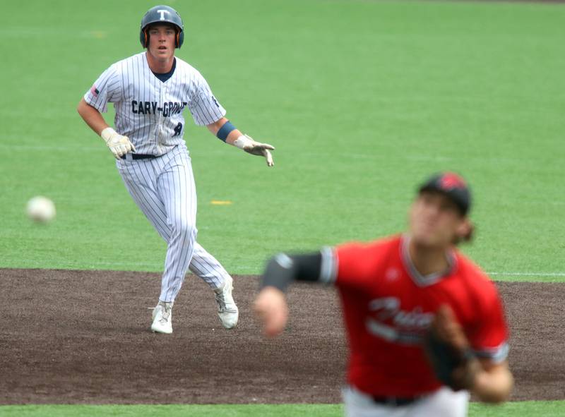 Cary-Grove’s Peyton Seaburg dances off second base as Triad’s Drew Winslow delivers in IHSA Class 3A Third Place Game baseball action at Slammer Stadium in Joliet on Saturday, June 14, 2025.