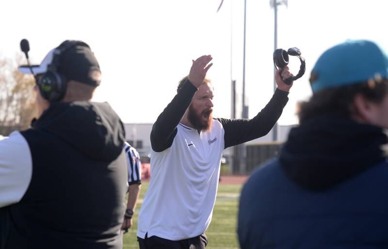 Fenwick's head coach Matt Battaglia encourages his fans to cheer during a defensive play at their playoff game against Brother Rice Saturday, Nov. 2, 2024.