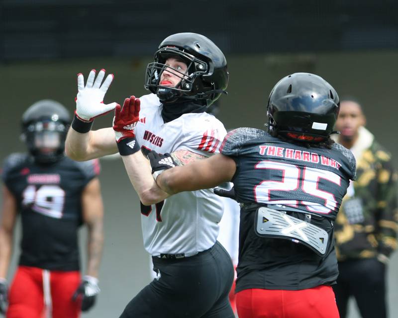 Northern Illinois University Grayson Barnes, left, attempts to catch the ball but was unsuccessful while being defended by Jake Gassaway during practice on Saturday March 30, 2024, held at Huskie Stadium in DeKalb.