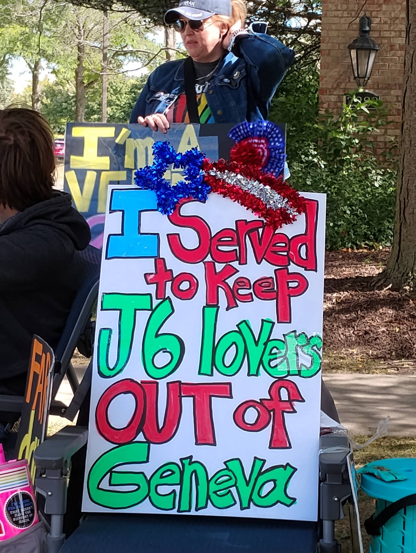 Jen Hall of Elburn protested in front of Eagle Brook Country Club in Geneva on Sunday, Sept. 7 against Elmer Stewart Rhodes III as a guest speaker there. Rhodes was convicted of seditious conspiracy and sentenced to 18 years in prison. President Trump commuted his sentence in January. Rhodes did not speak in Geneva, but was welcomed to a church in Elgin.