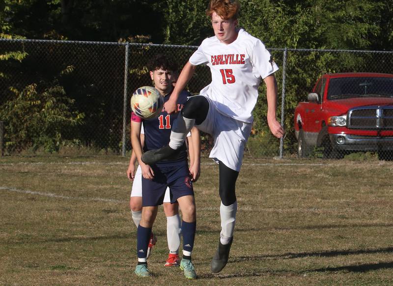 Earlville's Jeff Peterson kicks the ball away from DePue/Hall's Grabiel Cano during the Class 1A Regional quarterfinal game on Wednesday, Oct. 16, 2024 in DePue.