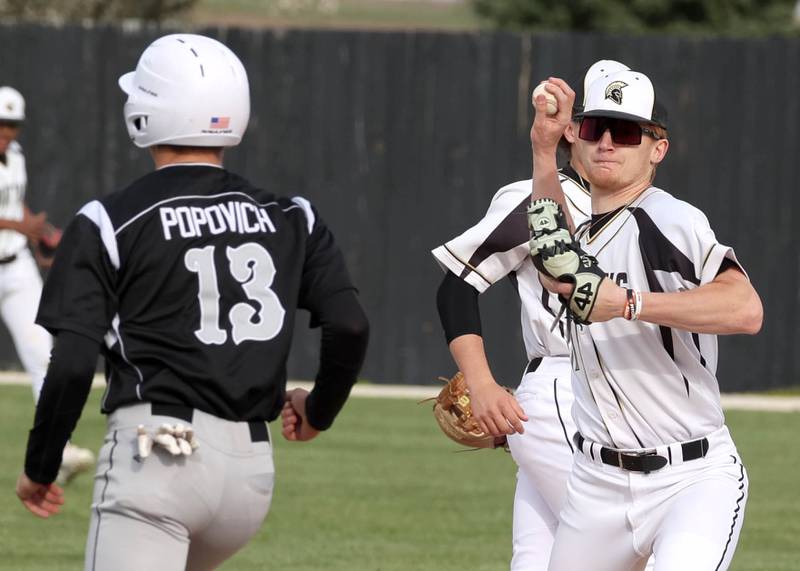 Sycamore's Teague Hallahan turns a double play as Kaneland's Preston Popovich is forced at second during their game Monday, April 22, 2024, at the Sycamore Community Sports Complex.