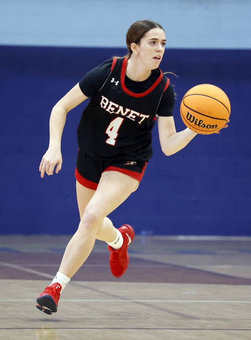 Benet's Ava Mersinger (4) handles the ball during a girls varsity basketball game between Benet and Nazareth academies on Saturday, Dec. 14, 2024 in La Grange Park.