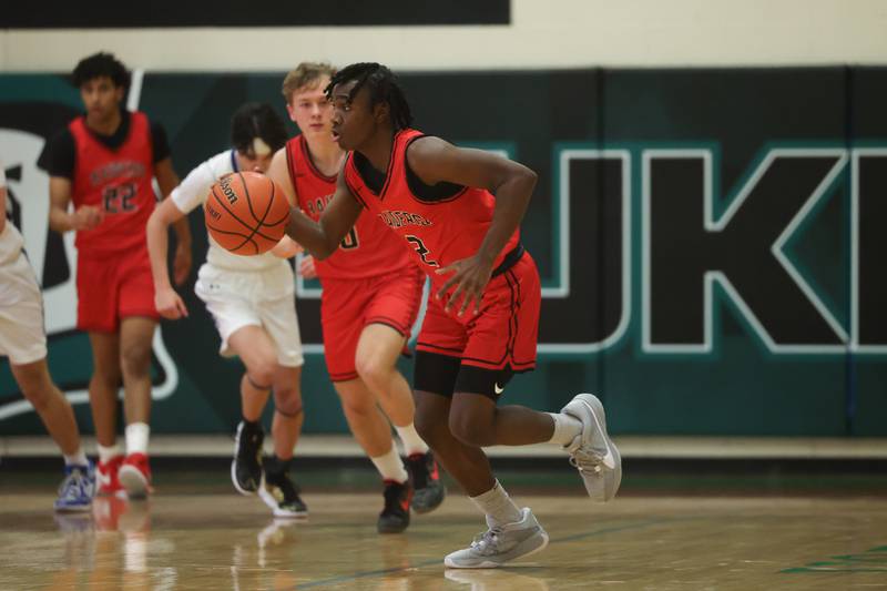 Bolingbrook’s DJ Strong takes the ball upcourt against St. Francis in the Jack Tosh 2023 Holiday Classic on Wednesday, Dec.27th, 2023 in York.