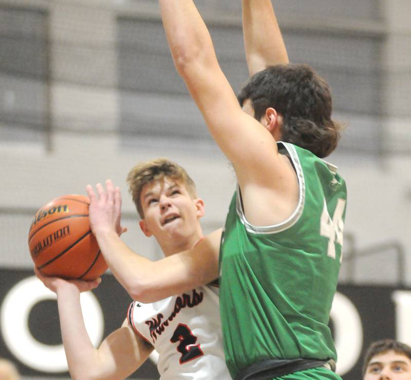 Woodland's Jon Moore looks to shoot past Dwight's Wyatt Thompson at the Warrior Dome on Friday, Jan. 13, 2023.