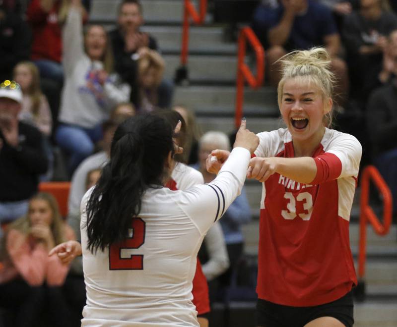 Huntley's Luma Acevedo, left, and Allyson Panzloff celebrate a point during the IHSA Class 4A Harlem Sectional Championship volleyball match Wednesday, Nov. 2, 2022, between Huntley and Hononegah at Harlem High School in Machesney Park.