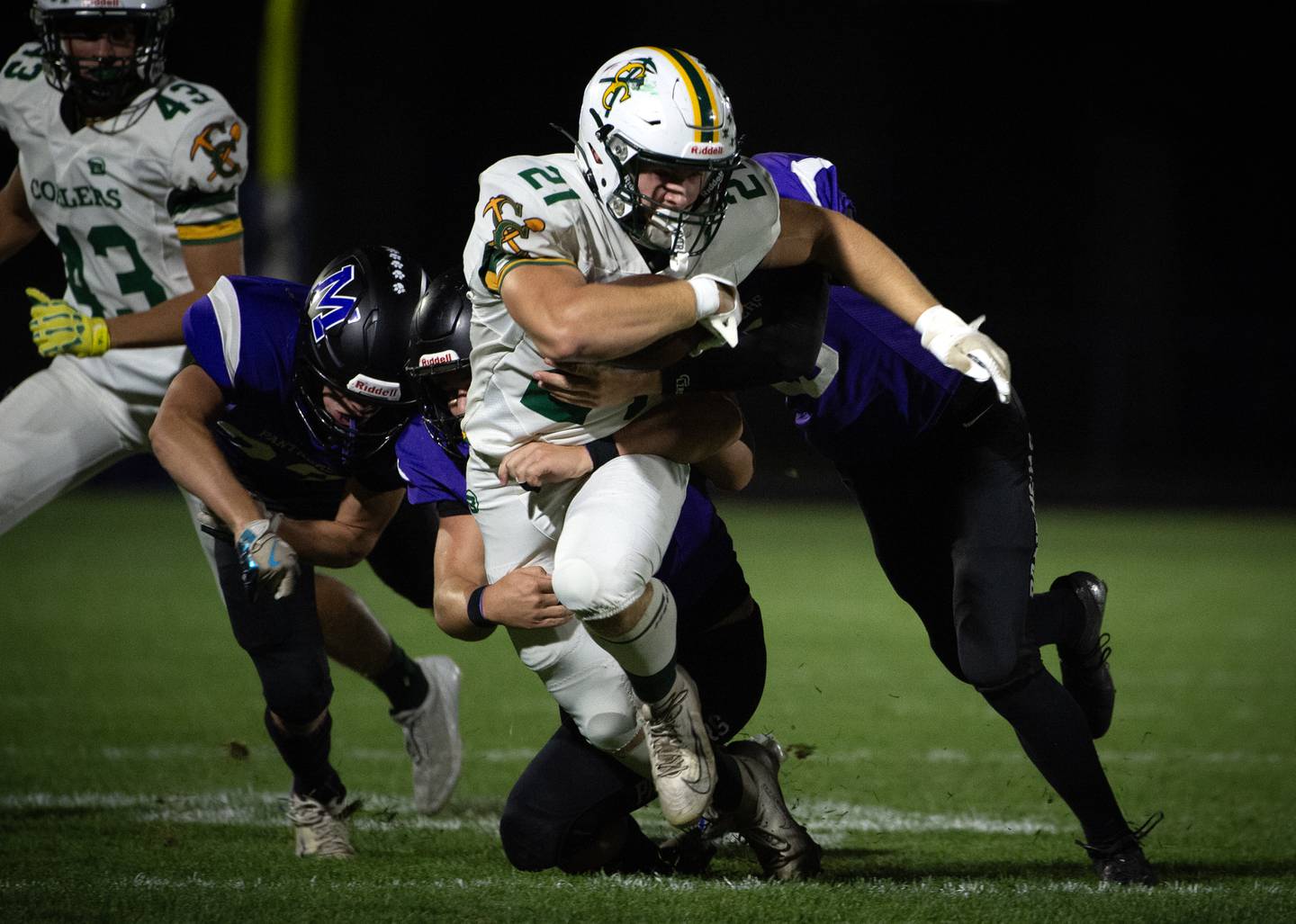 Coal City's Logan Natyshok carries the ball on a play and tries to shake off a trio of Manteno players in a game on Friday, October 3, 2025.