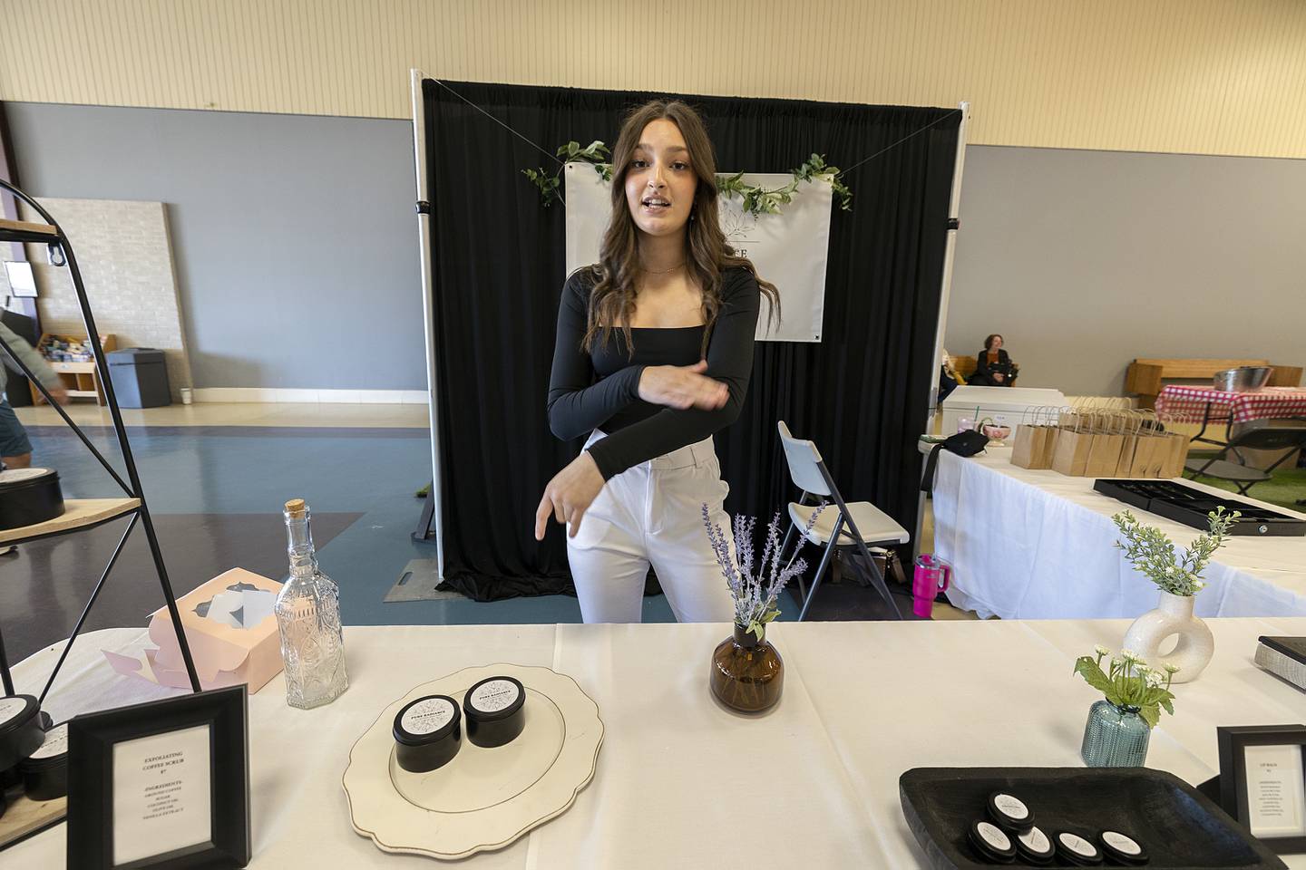 Olivia Clark, Newman High School junior, offers all-natural skin products from her “Pure Radiance” line Wednesday, April 24, 2024 at the WACC CEO trade show.